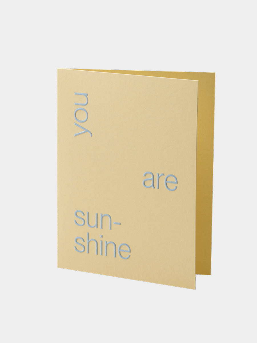 Beige greeting card with 'you are sunshine' text on a white background